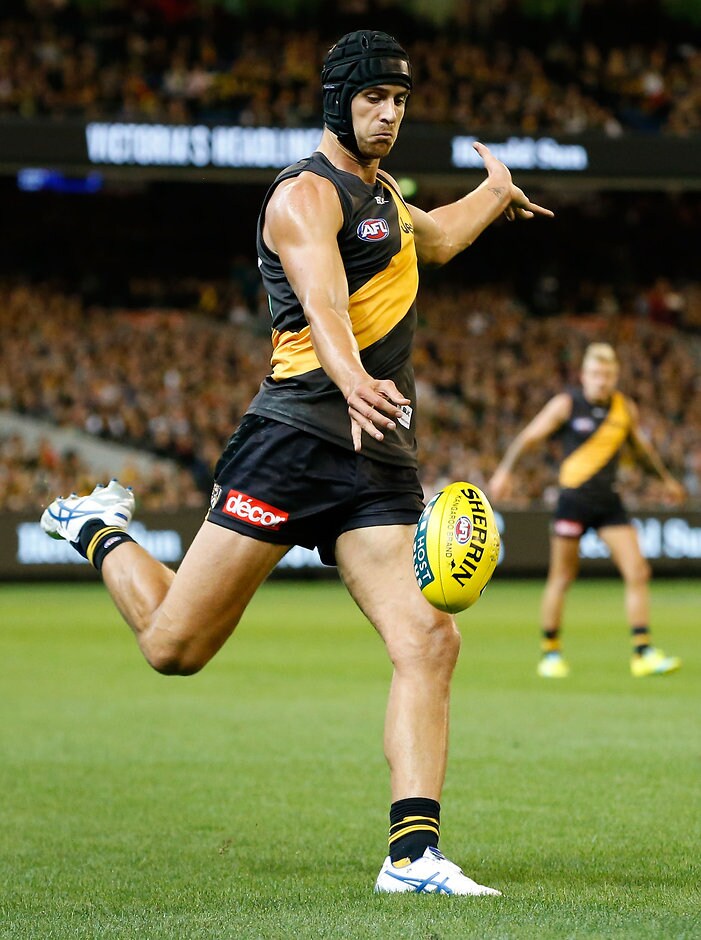 AFL 2016 Rd 01 - Richmond v Carlton MELBOURNE, AUSTRALIA - MARCH 24: Ben Griffiths of the Tigers kicks the ball during the 2016 AFL Round 01 match between the Richmond Tigers and the Carlton Blues at the Melbourne Cricket Ground, Melbourne on March 24, 2016. (Photo by Adam Trafford/AFL Media)